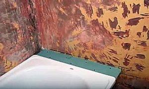 Как заделать стык между ванной и стеной